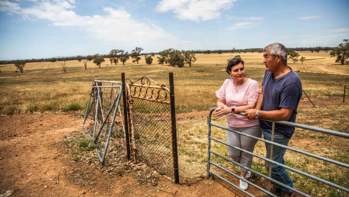 John Harper discussing mental health issues with Julie Andreazza on her family farm near Willbriggie. Photo: Photography by Erin Johnson for room3.com.au
