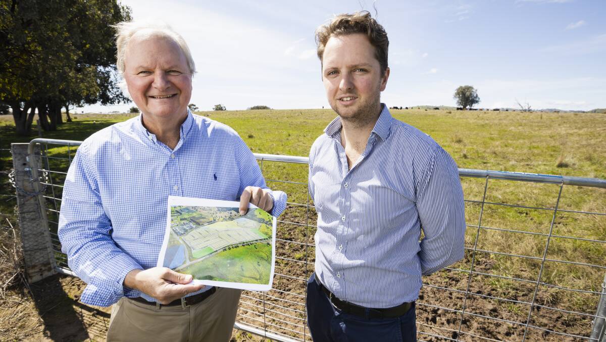 Agents Andrew and Oscar Dixon at the Kerr Road property on Friday. Mr Dixon says the site has long been used for farming but since being rezoned has emerged as an ideal site for a new housing project. Picture by Ash Smith