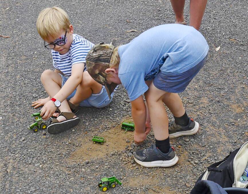 The likely next generation of farmers at play during the mine protest as George Brady and Alex Cunning make use of their John Deere toys.