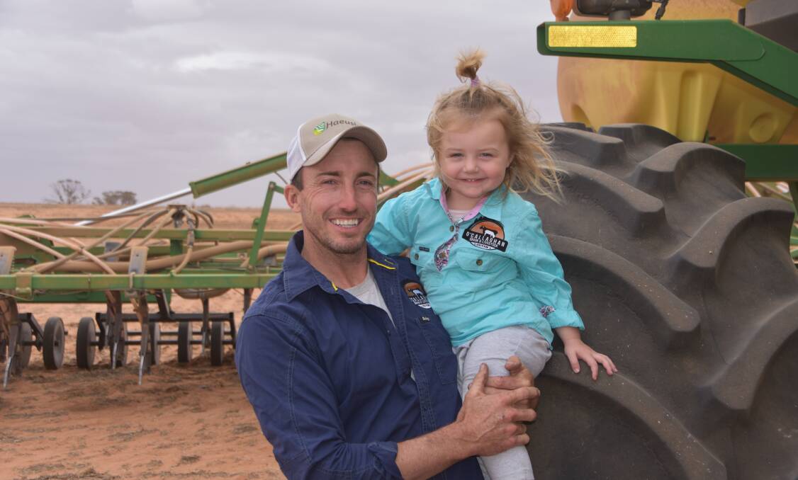 FRESH: Ouyen farmer Adam O'Callaghan, with daughter Daisy, was dry sowing oats when pictured but is hoping for an autumn break to kickstart the planting season proper.