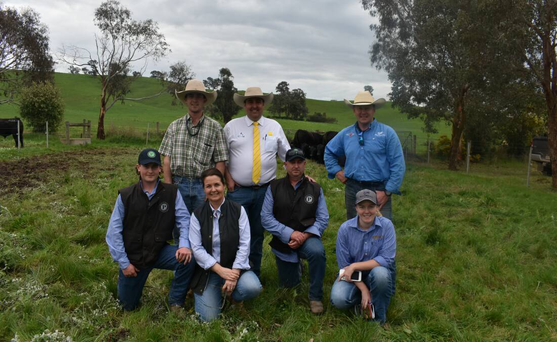 Monty, Oscar and Olivia Lawson, Ray White GTSM auctioneer James Brown, Tom Lawson, the joint buyer of the top bull WWS Beef Sales manager Dale Edwards and Annie Edwards at the sale.