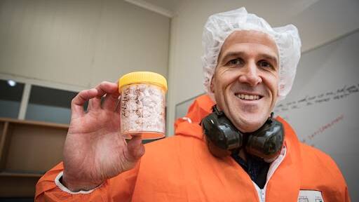 ProviCo chief executivee Ben Anderson holding a jar of product from the Lactoferrin plant. Picture by Sean McKenna