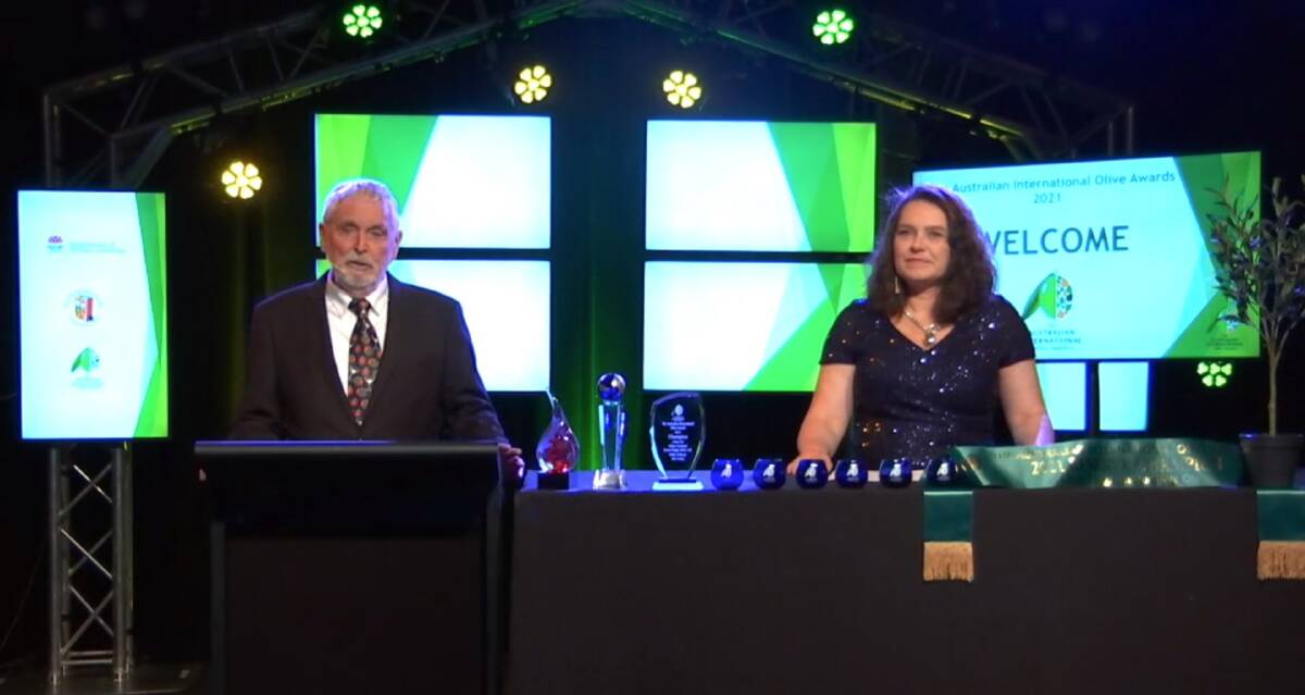 VIRTUAL: The Australian Olive Association's Kent Hallett and competition chief steward, Trudie Michels, begin the virtual awards ceremony for the 2021 Australian International Olive Awards in October. 