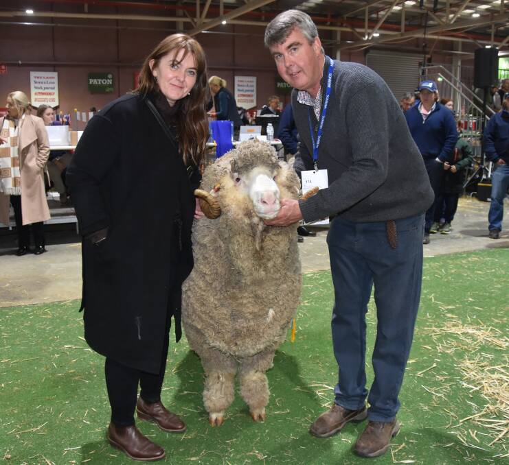 Kel and Garry Cox, Langdene, Dunedoo, NSW, with the supreme Merino and Poll Merino exhibit at the Australian Sheep & Wool Show. Picture by Elizabeth Anderson