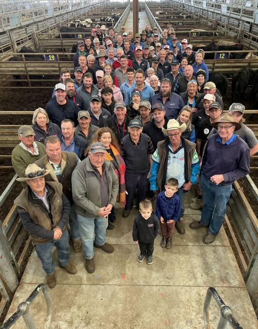 A group photo made up of graziers, agents and onlookers after the last pen of cattle was sold at Pakenham on June 27, 2024. Picture by Bryce Eishold