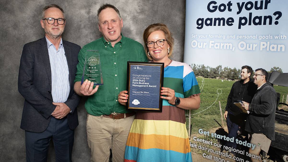 Neil Webster, Dairy Australia, with Greg and Kim Wilson, Irrewillipe, who won the Dairy Farm Business Management Award. Picture supplied