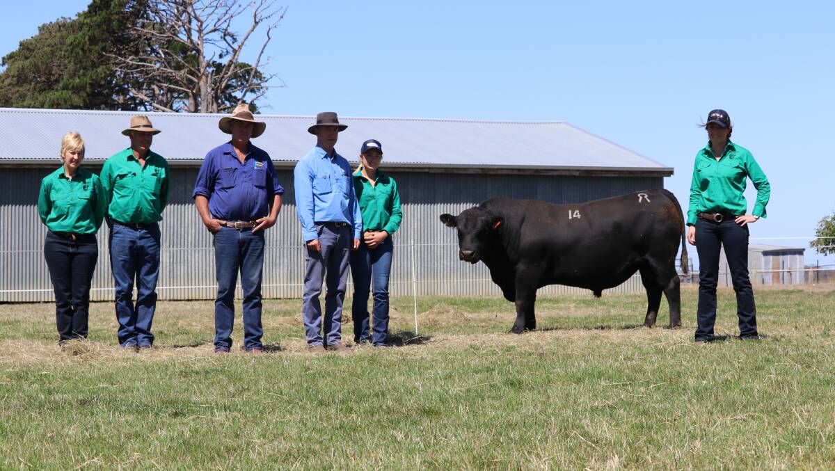 BIG BUY: Claremont Angus stud principals Liz and Graeme Glasgow, top-priced buyer John Woodward, with Alister Nash, Georgina Rankin and Esther Glasgow, and the top bull.