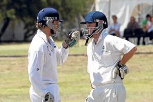 Tom Butler, Barwon Heads, Victoria, and Adam Ross, Red Cliffs, Vic, talk tactics (or perhaps whether it’s time for a drinks break) during the 2009 Colombo Creek cricket match.