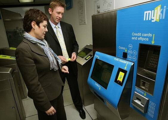 Ms Kosky tests the new public transport 'smart' ticketing system, Myki, with Transport Ticketing Authority chief Gary Thwaites in June. Photo: John Woudstra
