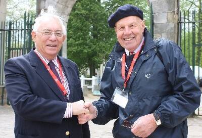 Outgoing president of the World Federation of Merino Breeders, Glen Keamy of Perth, WA, congratulates his successor, Robert Ashby, Old Ashrose, Hallett, SA, at last week’s eight World Merino Conference at the Bergerie Nationale, Rambouillet, France.