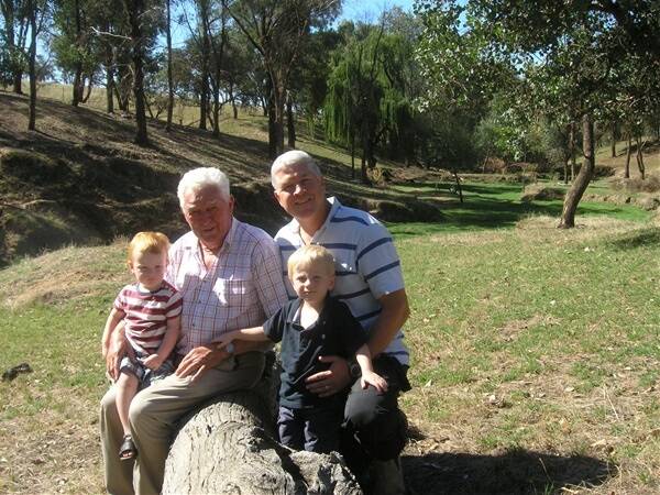 John Mitchell, 'Arcot', Bethanga, pictured with his son Ross and grandsons Geordie, 3, and Kalan, 18 months, admires the results of tree plantings made 21 years ago. His pioneering land management approach won him widespread acknowledgement long before the Landcare got into gear.   