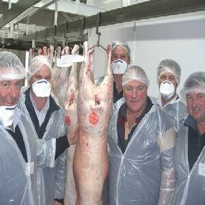 Suited up RMA agents get pointers on lamb carcases from MC Herd, livestock manager Nigel Vince at a paddock to plate workshop held in Geelong last week. 