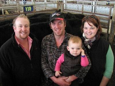 Phil and Julia Allen, Budgeree, were at Pakenham Thursday to see their 25 Angus mixed-sex weaners top at $642 and average $579. The couple are pictured with daughter Olivia, 16 months, and Elders’ agent Alex Dixon.